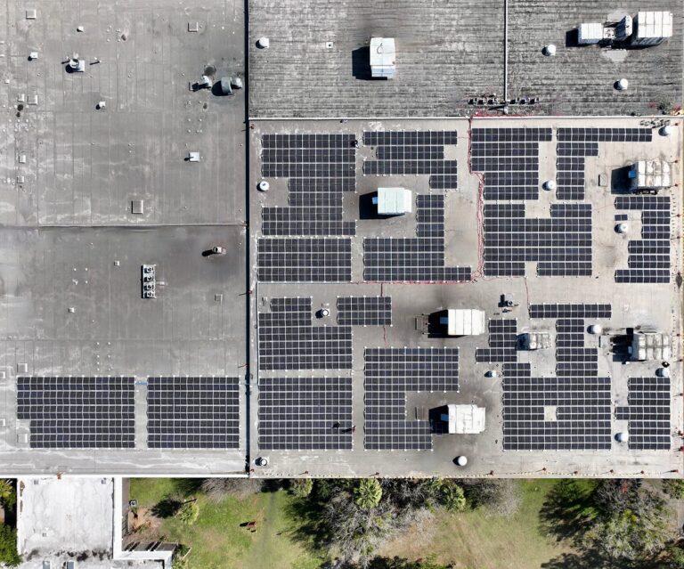 Top-down aerial of the OFAB Manufacturing rooftop solar array