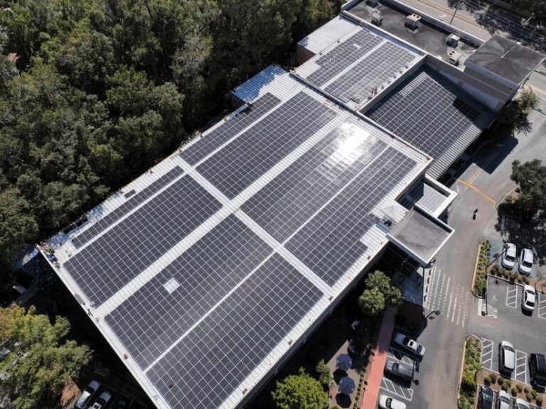 Top-down aerial of a commercial rooftop solar array