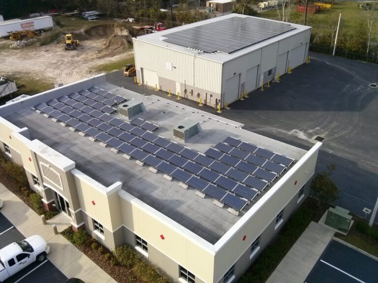 Aerial view of a commercial warehouse rooftop solar array